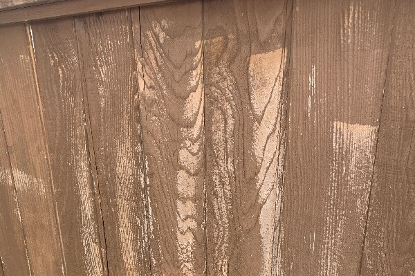 Looks new again! Clean and no damage to wooden fence.
